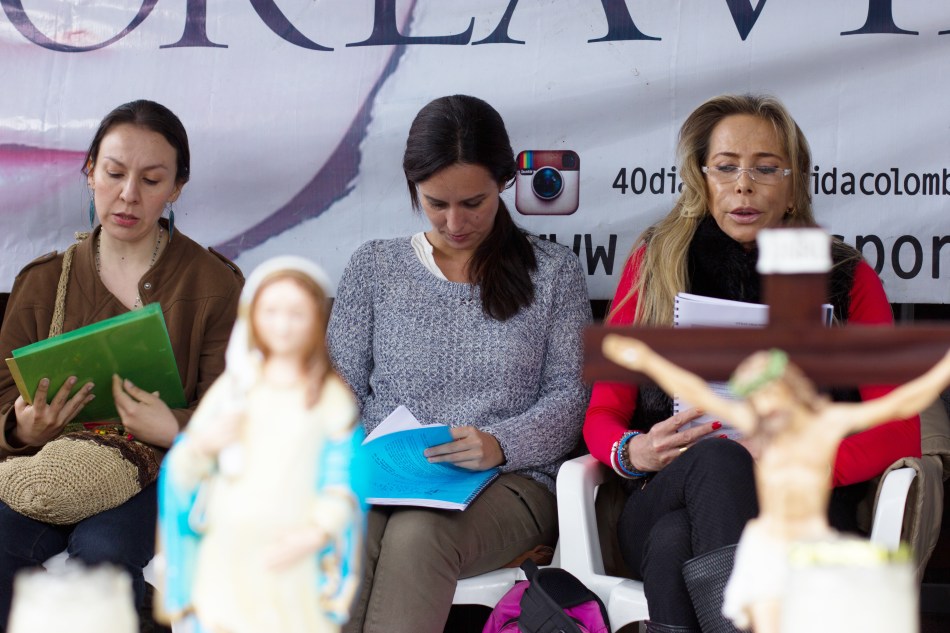 Pamela Delgado, center, leads reading during March 2017 protest.jpg